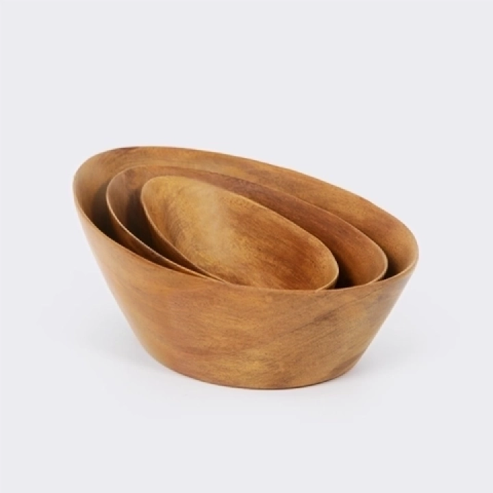 Set of three oval nesting bowls, handcrafted from sohihy wood with a natural finish.
